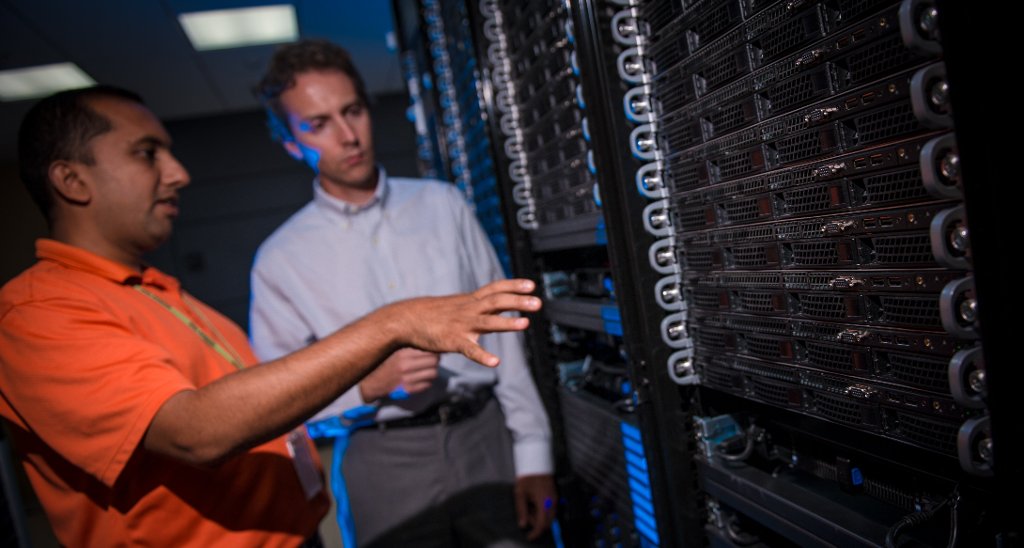 Greg Odegard, right, and Gowtham discuss Superior, the high-performance computer cluster that will play a major role in the Space Technology Research Institute headed by Michigan Tech.