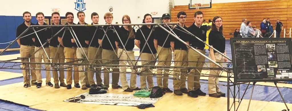 Michigan Tech's Steel Bridge Team demonstrates the configuration of their competition bridge.