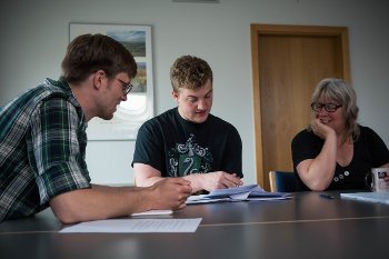 Six students, including Cameron Miller from Michigan Tech (center), are working on biosensor tech with researchers from Aarhus University in Denmark.