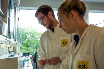 Anna Mendelson, a biochemistry major from the University of Virginia, and her lab partner, Jacob Crislip, a chemical engineering major from Purdue University, will be prep cell cultures at Aarhus University. Credit: Taran Schatz