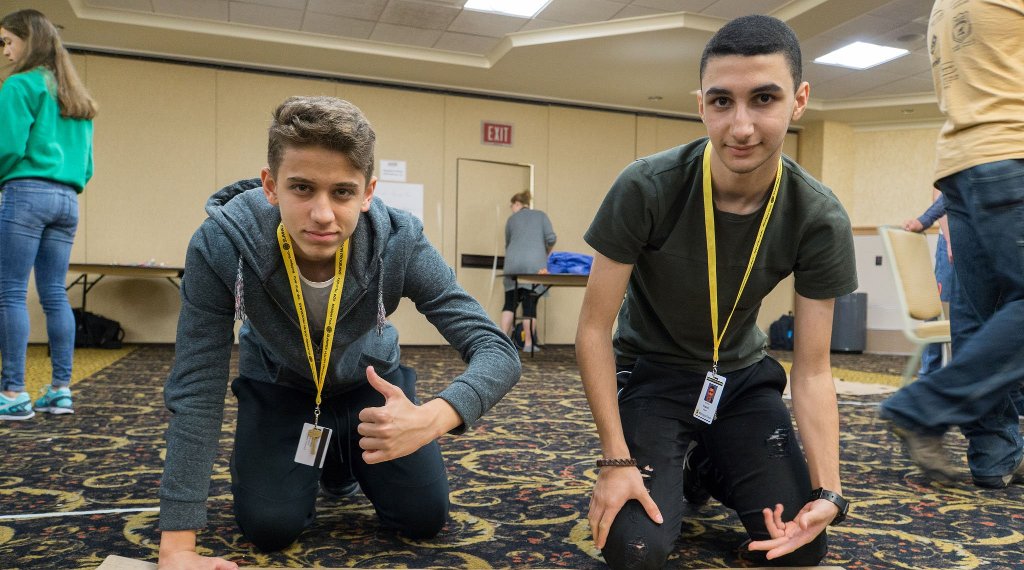Sarp Tatlici, left, of Turkey, poses with Husain Hasan of Bahrain while working on a project during the Engineering Scholars Program at Michigan Tech's Summer Youth Program in June.