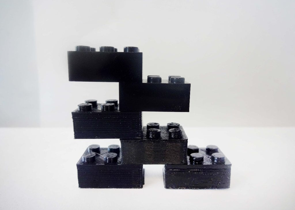 Each plastic building block is made of a different plastic and process; 3-D printing has the potential to disrupt conventional toy production, making it cheaper to make toys at home.