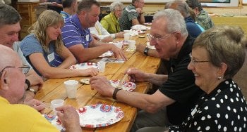 People sitting around a table eating.