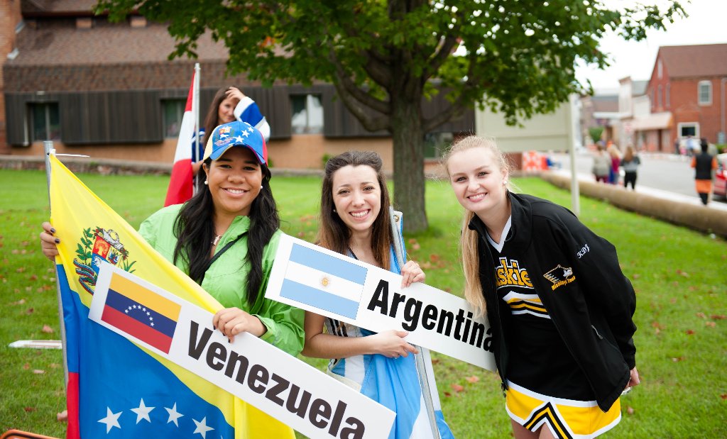 Students, faculty and families from all over the world carry their flags in the Parade of Nations.