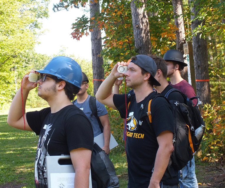 Woodchuck Students use clinometers in field techniques class. Students eyeball tree height using clinometers. The field techniques course is composed of 14 labs covering natural resources management essentials.
