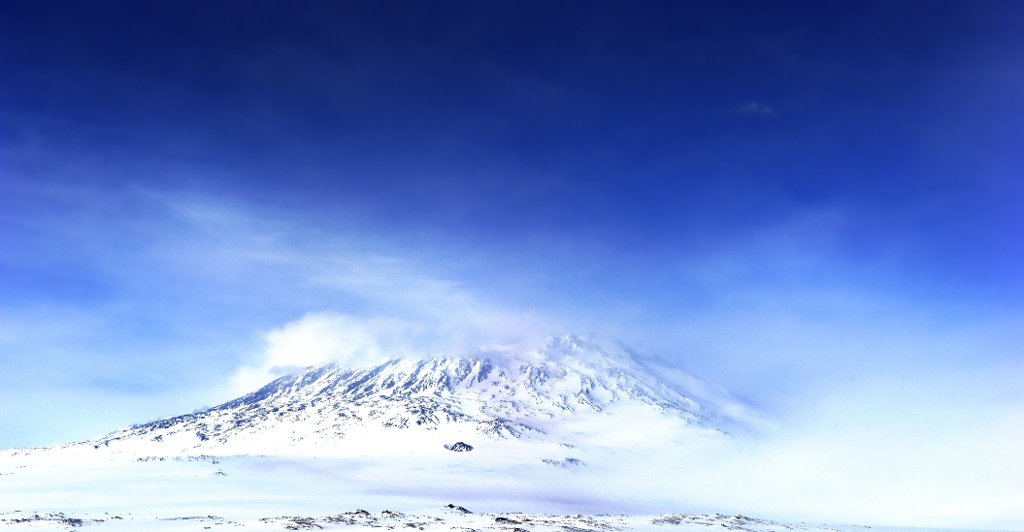 Mount Erebus in Antarctica is a modern example of alkaline volcanism.