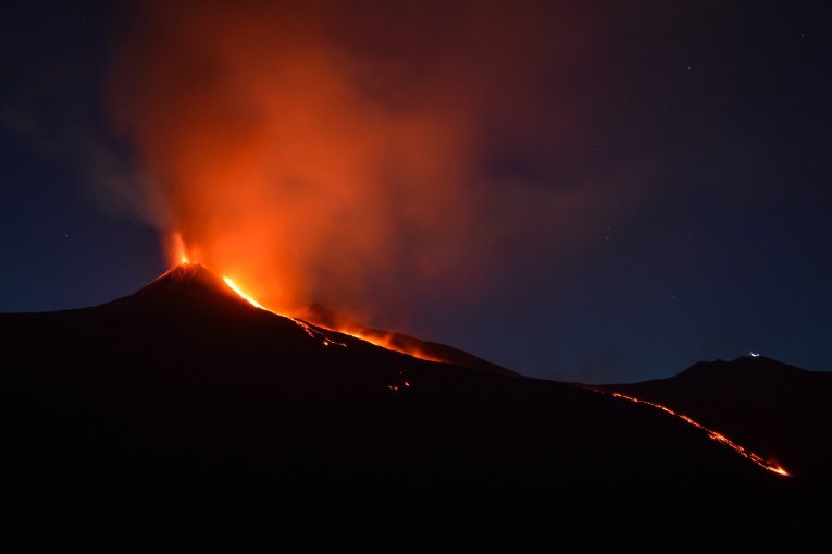 Mount Etna in Italy is a modern example of alkaline volcanism. Credit: Shawn Appel on Unsplash