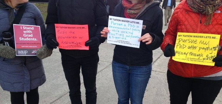 Brookins signs Michigan Tech's Graduate Student Government participated in a nationwide walkout on Nov. 29 to support higher education and show how vital graduate students are to society.