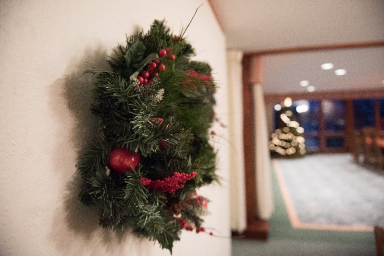 Sustainability House wreath light Like any other students on a budget, tenants repurpose what they found in the house, including holiday decorations. Every day they're implementing small and big changes, from replacing lightbulbs to powering up a solar array in the new year.