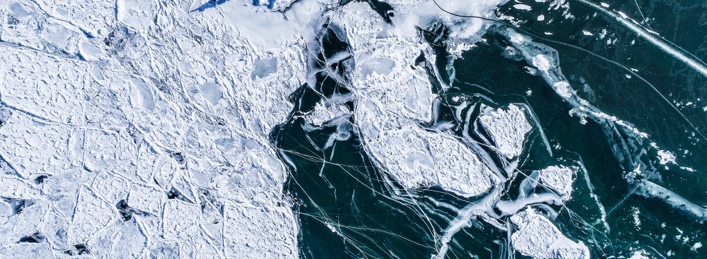 The winter waters of Lake Superior make geometric art around the Keweenaw Bay where local Ojibwe families have fished for generations.