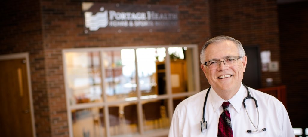 Dr. Bruce Trusock, '74, receives the Michigan Tech Board of Trustees Silver Medal during Winter Carnival 2018.