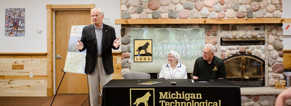 Michigan Tech President Glenn Mroz, Ruth Nara and School of Forest Resources and Environmental Science Dean Terry Sharik attend a signing ceremony June 28, at Nara Park. Ruth Nara donated a 648 acre forest in Torch Lake Township to SFRES.