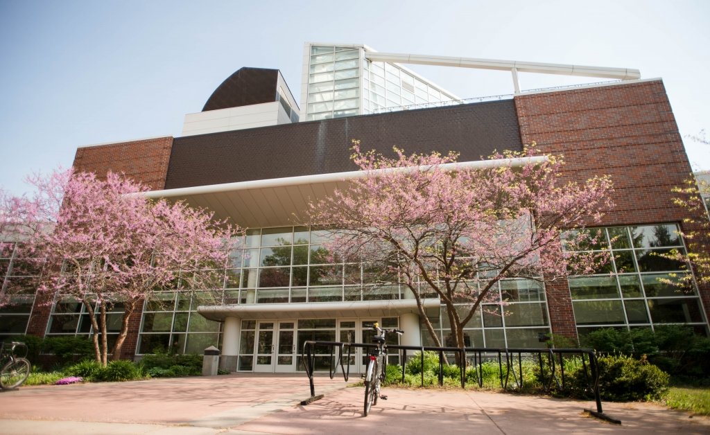 The Dow Environmental Sciences and Engineering Building with budding trees