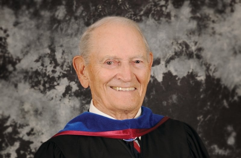 Formal headshot of Raymond Smith