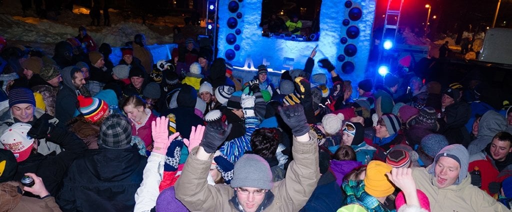 Students dance outside to music in a snow-supported sound system, during the annual All-Nighter.