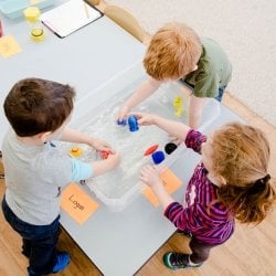 Children playing with bathtub toys