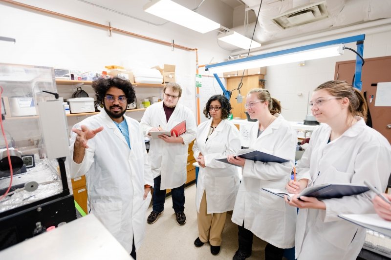 team standing in a lab