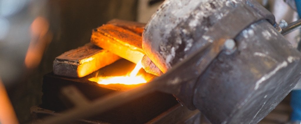 crucible in a foundry pouring molten metal