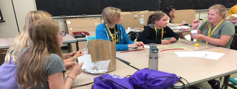 Young girls working on a project at a table