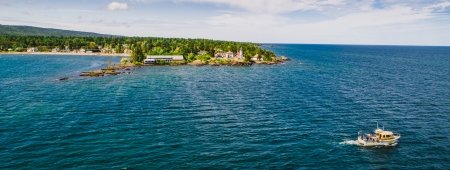 Student researchers ply the wild blue yonder off the rocky shore of Eagle Harbor, Michigan.