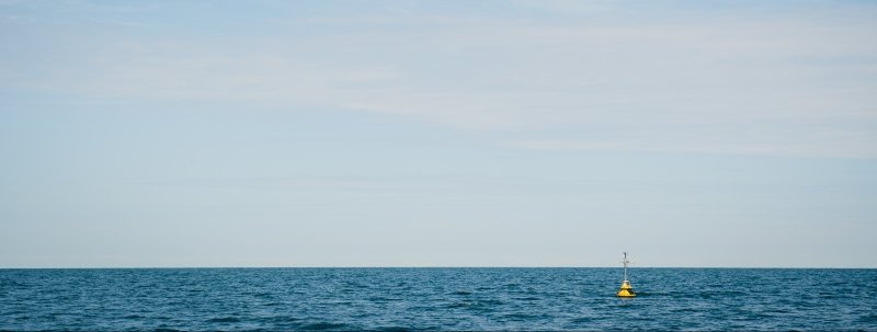 A buoy floats in the water.