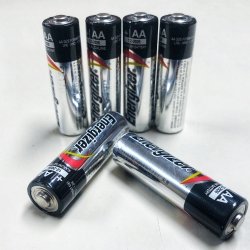 Six Energizer AA batteries on a white background