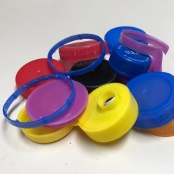 13 bottle caps and three plastic milk jug rings