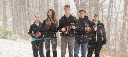 Students living in the Sustainability Demonstration House brandish one of the latest contributionsâ€”from Milwaukee Tools. Huskies actively seek partnerships to upgrade the former Michigan Tech presidential residence that now serves as a community-wide education resource.