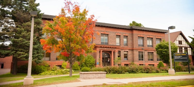 Exterior of Academic Offices Building in spring on the Michigan Tech campus