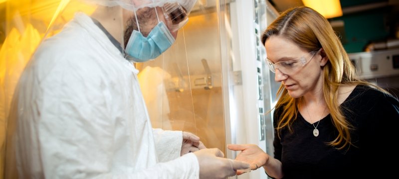 man and woman standing in a lab with 