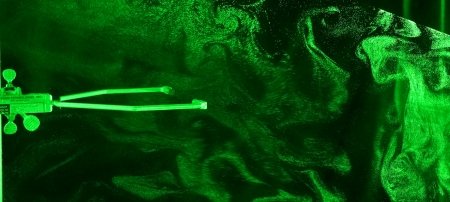 A sonic temperature sensor and cloud droplets in the laser sheet inside Michigan Tech's cloud chamber. Image Credit: Will Cantrell