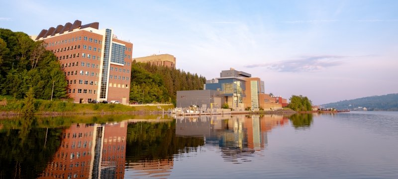 The Great Lakes Research Center and its reflection in the waters of the Keweenaw Waterway.