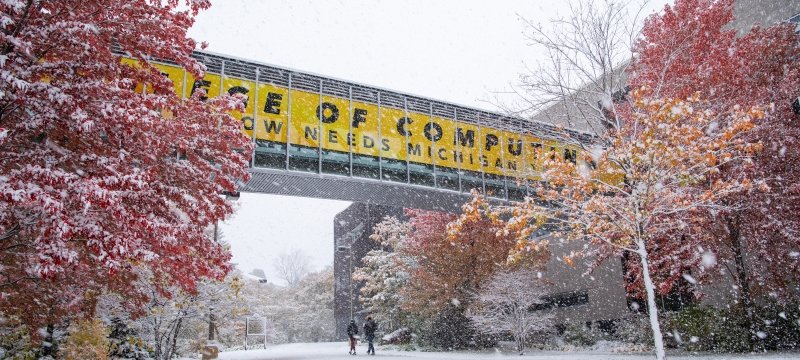 Michigan Tech sky bridge with fall color and first snow