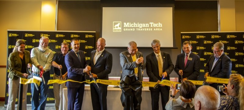 A large yellow ribbon with Michigan Tech Grand Traverse Area written on it
