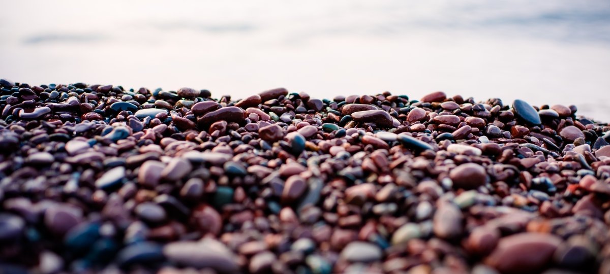Like pebbles on a beach, projects pile up. The pandemic was a storm that helped library scholars clear the rubble. Stones on the shore of Lake Superior
