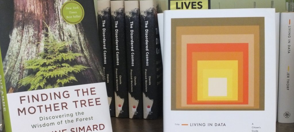 Book covers including Finding the Mother Tree, The Disordered Cosmos, and Living in Data.