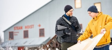 Research on the benefits of pumped underground storage hydro (PUSH) took place at one Upper Peninsula mine but is applicable to post-mining communities around the world, including the Copper Country, where researchers Roman Sidortsov and Timothy Scarlett, from left, are shown discussing the possibilities in the snowy spring of 2022.