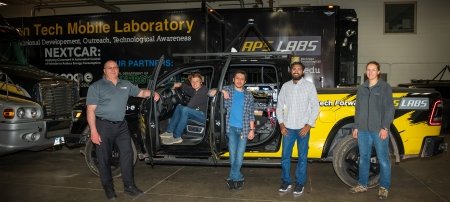 Researcher and Professor Jeff Naber is shown with students and staff in and around the autonomous pick-up at APS-LABS.