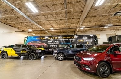 Four cars, a pickup, a semi-trailer and a mobile lab are part of the APS-LABS mobility fleet at Michigan Tech.