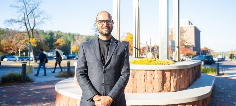 A Michigan Tech UN climate summit delegation member stands on campus as the group prepares to head to Egypt.