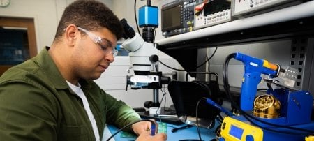 A student works in the Plexus electronics lab at Michigan Tech