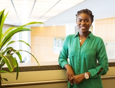 The graduate school speaker for MTU poses in the library.