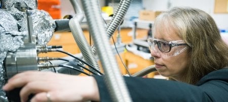 The accomplishments of Assistant Professor Kathryn Perrine, shown here in her lab, and her mentee, research assistant Chathura de Alwis, resulted in new insights into the chemical mechanisms of oxidation-reduction â€” or redox â€” reactions on iron and other earth-abundant metals and materials.