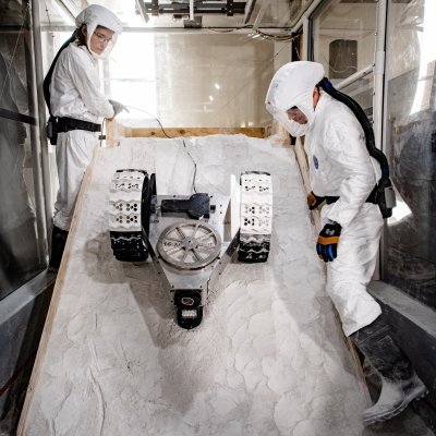 PSTLD researchers guiding lunar rover over simulated regolith