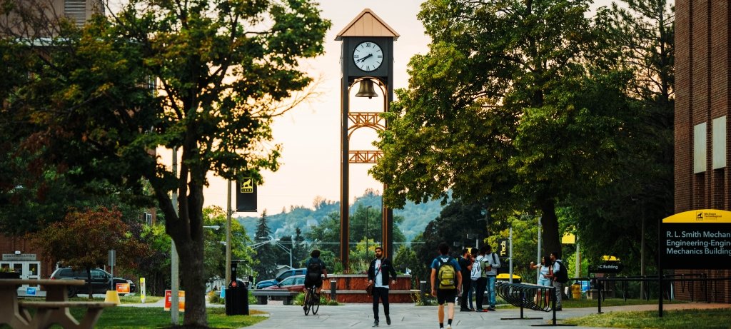 Students strolling along the sidewalk during Orientation Week.