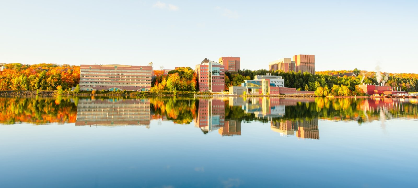 Campus reflection on the Keweenaw Waterway in fall