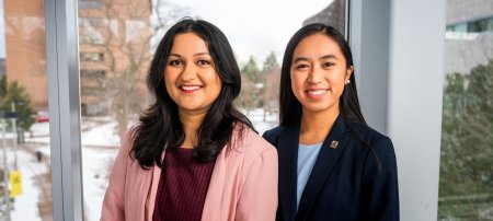 Michigan Tech's 2023 Midyear Commencement graduate and undergraduate student speakers post in the Rekhi-Library walkway on the MTU Campus.