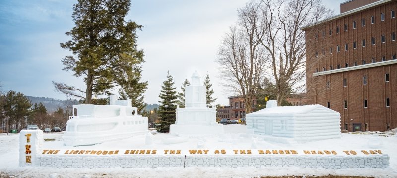 The 2024 winning statue entry at Michigan Technological University's Winter Carnival titled “The Lighthouse Shines the Way as the Ranger Heads to Bay.”