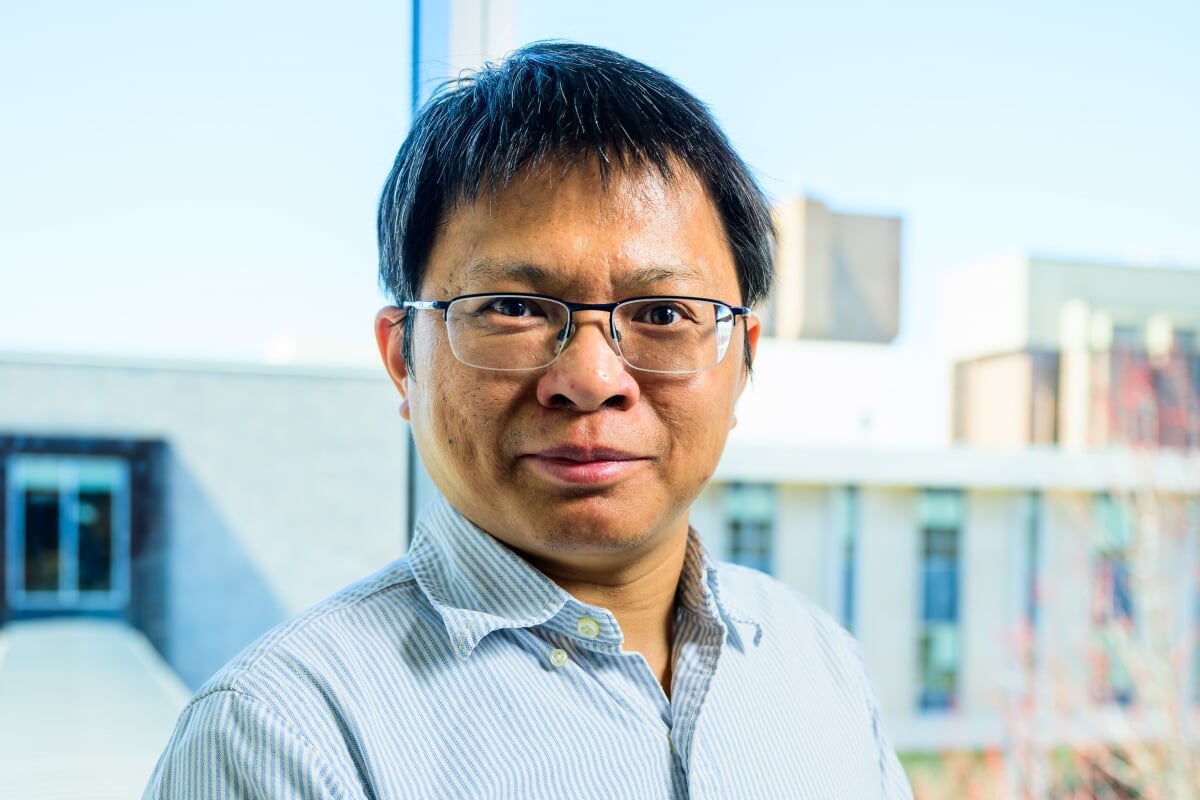 Cybersecurity expert Bo Chen, who recently won the Michigan Tech Bhakta Rath Research Award, smiles during a photo session in Rehki Hall, College of Computing.