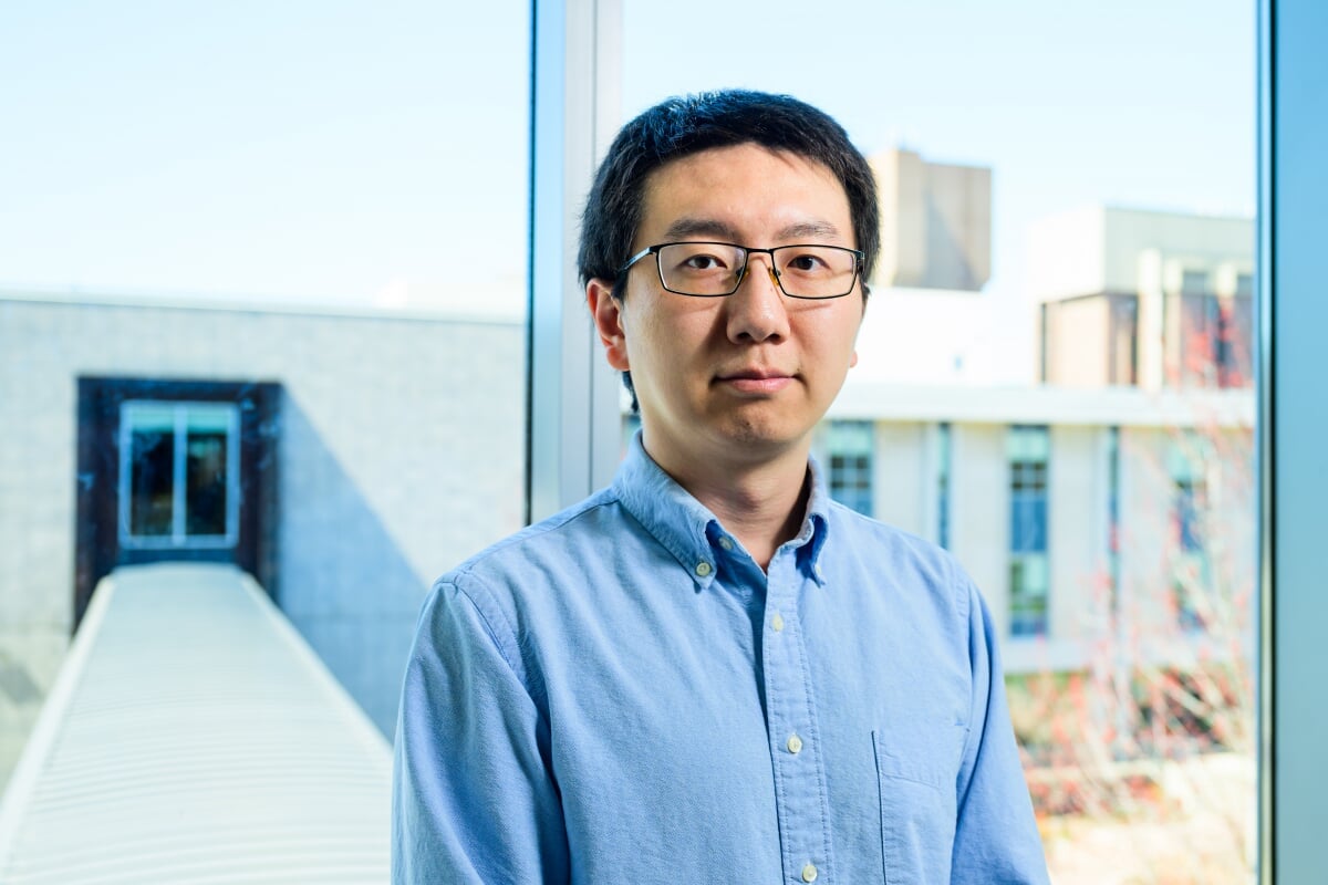 Cybersecurity researcher Niusen Chen has his portrait taken after co-winning the 2024 Bhakta Rath Research Award at Michigan Tech